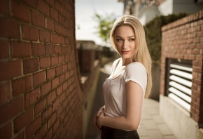 women, blonde, portrait, depth of field, wall, bricks, looking away