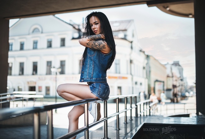 Anastasia Rozhdestvenskay, women, model, black hair, ass, sitting, jean shorts, skinny, long hair, denim, tattoos, portrait, looking at viewer, sneakers, sensual gaze, pierced nose