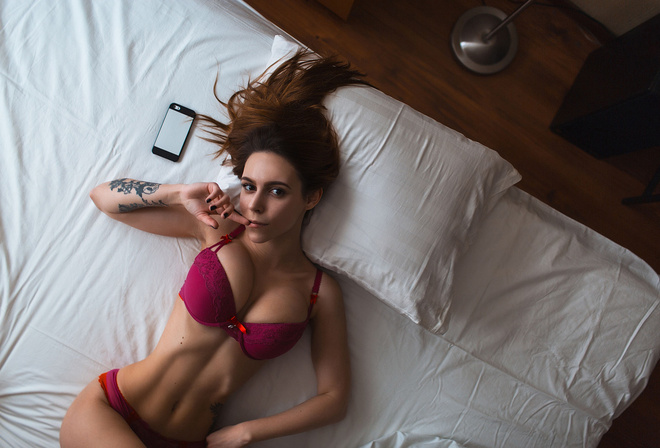 women, top view, tanned, belly, tattoo, cellphone, in bed, black nails, finger on lips, lingerie, portrait