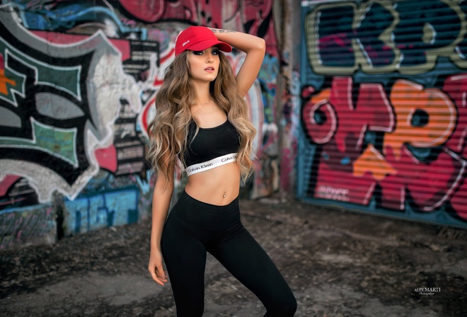 Aleksandra Taranova, women, Calvin Klein, portrait, sportswear, yoga pants, sports bra, tanned, graffiti, sneakers, baseball caps, belly, long hair, pierced navel, tattoo