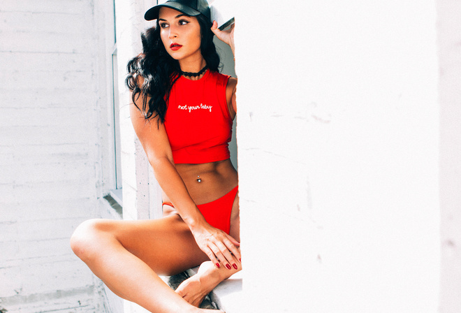 women, tanned, red panties, belly, T-shirt, baseball caps, pierced navel, red nails, choker, sitting, red lipstick