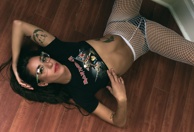 women, top view, T-shirt, tanned, on the floor, fishnet stockings, tattoo, black panties, lying on back, belly, women with glasses