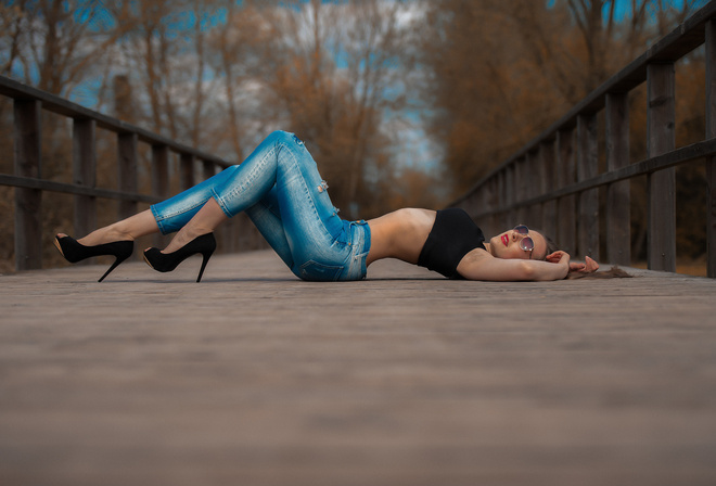 women, on the floor, lying on back, sunglasses, jeans, tanned, arched back, red lipstick, depth of field, torn jeans, women outdoors, armpits, closed eyes