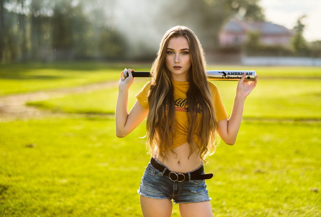 women, yellow t-shirt, belly, grass, long hair, belt, jean shorts, women outdoors, baseball bat