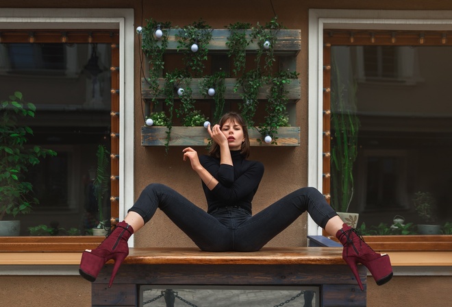 women, sitting, jeans, spread legs, black clothing, window, high heels, plants, red lipstick, table