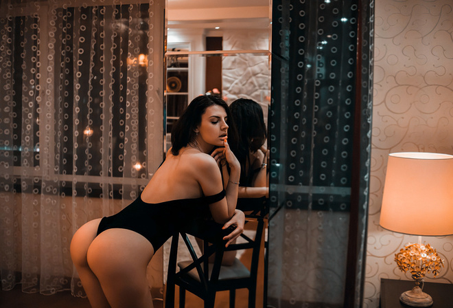 women, ass, lamp, mirror, reflection, window, bodysuit, finger on lips, women indoors, painted nails, chair
