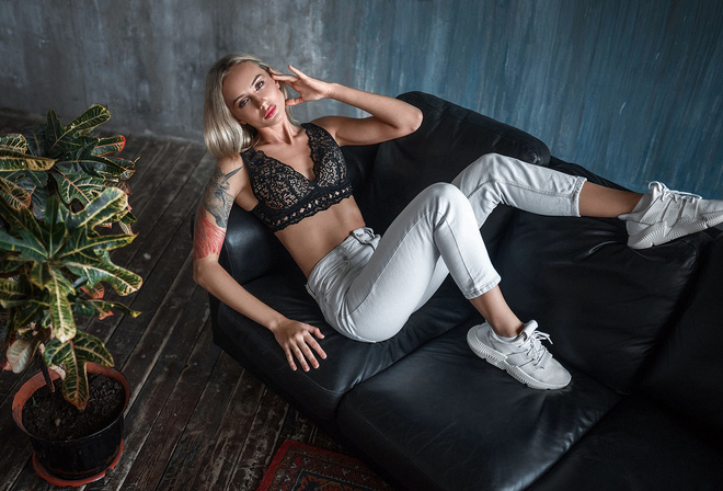 women, blonde, top view, couch, wall, wooden floor, plants, tattoo, sneakers, pants, cleavage, brunette, women indoors