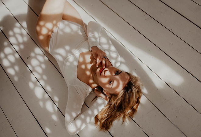 women, blonde, lying on back, top view, wooden floor, bodysuit, red lipstick, women indoors, on the floor, shadow