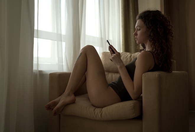 women, sitting, bodysuit, window, curtain, cellphone, tattoo, women indoors, nose ring, armchair