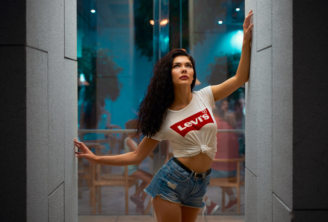 women, jean shorts, glass, white t-shirt, belt, chair, table