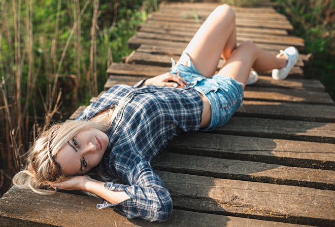 jean shorts, road, blonde, wooden surface, walkway, women outdoors, sneakers, women, , plaid shirt, lying on back, model