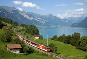 train, mountain train line, lake, village