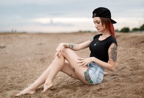 Julia Tyki, women, skinny, baseball caps, sitting, dyed hair, jean shorts, sand, nose rings, necklace, depth of field, tattoos