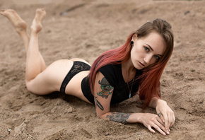 Julia Tyki, women, ass, skinny, sand, dyed hair, tattoos, feet in the air, black panties, nose rings, pierced nose, T-shirt, necklace, Igor Marushevskii