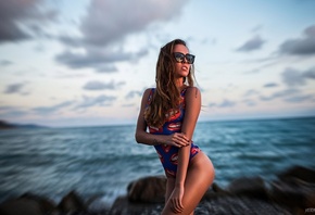 Olga Malysheva, women, ass, tanned, one-piece swimsuit, sea, beach, sunset, sunglasses, women with glasses, portrait, tattoos, black nails