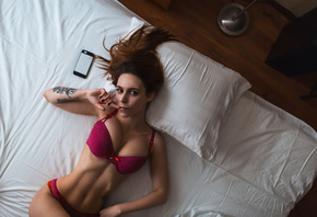 women, top view, tanned, belly, tattoo, cellphone, in bed, black nails, finger on lips, lingerie, portrait