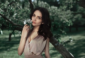 women, brunette, women outdoors, face, blue eyes, portrait, cleavage, wide jaw, depth of field, flowers, Nikolay Shlykov