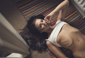 women, underboob, T-shirt, top view, belly, on the floor, pierced navel, ribs, Jack Russell, brunette, boobs, finger in mouth, lying on back, looking at viewer