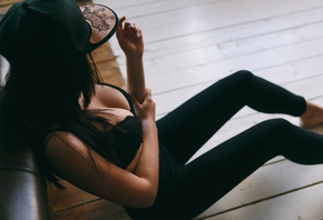 women, tanned, sitting, baseball caps, black bras, yoga pants