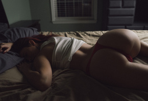 women, ass, tanned, in bed, pillow, red panties, T-shirt, lying on front, closed eyes, red nails, redhead
