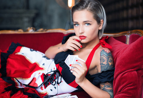 women, portrait, dress, red nails, blue eyes, tattoo, red lipstick, short hair, couch, nose rings, piercing, playing cards, depth of field