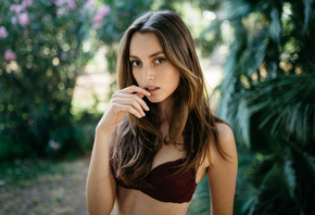 women, brunette, tanned, finger on lips, depth of field, denim