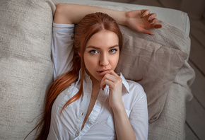 women, face, portrait, redhead, white shirt, finger on lips, painted nails, long hair, couch, top view