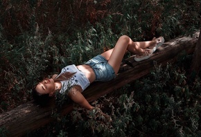 women, jean shorts, sneakers, closed eyes, tank top, pierced navel, lying on back