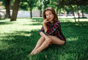 women, sitting, grass, women outdoors, finger on lips, plaid shirt, trees