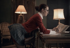 women, lamp, women indoors, skirt, hairbun, chair, garter belt, red sweater, mirror, books, kneeling, women with glasses, reflection