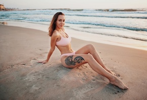 women, brunette, beach, sand, sea, sunset, women outdoors, sitting, pink bikinis, smiling, belly, necklace, sand covered, tattoo