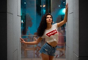 women, jean shorts, glass, white t-shirt, belt, chair, table