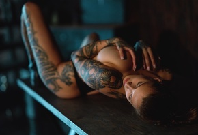 Evgenia Talanina, women, model, brunette, women indoors, lying on back, table, black panties, panties, thong, black thong, ass, tattoo, no bra, closed eyes, big boobs