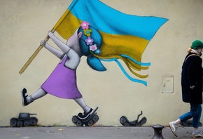 France, street art, mural, Paris, girl with a Ukrainian flag walking on tan ...