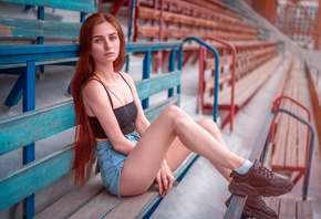 women, model, redhead, women outdoors, jean shorts, black top, sneakers, socks, sitting, stadium