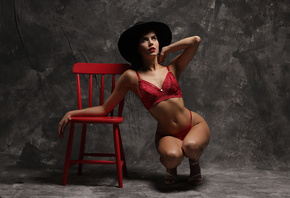 brunette, women, model, studio, women indoors, red panties, red bra, red lingerie, squatting, hips, lingerie, curvy, red chair, chair, black hat, pierced navel