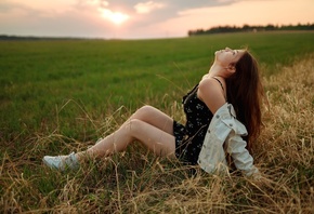 women outdoors, model, brunette, women, dress, black dress, denim jacket, jacket, open jacket, grass, field, sunset, sneakers, nature, sky, clouds