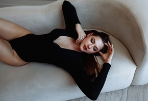 model, women, brunette, hips, couch, women indoors, black bodysuit, bodysuit, wooden floor