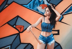 women, model, women outdoors, urban, women, bubble gum, bubblegum, blue tops, jean shorts, polka dots, baseball bat, shorts, hips, graffiti