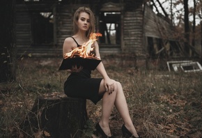 black dress, women outdoors, cottage, hut, ruins, women, dress, brunette, books, fire, model, sitting, grass, trees