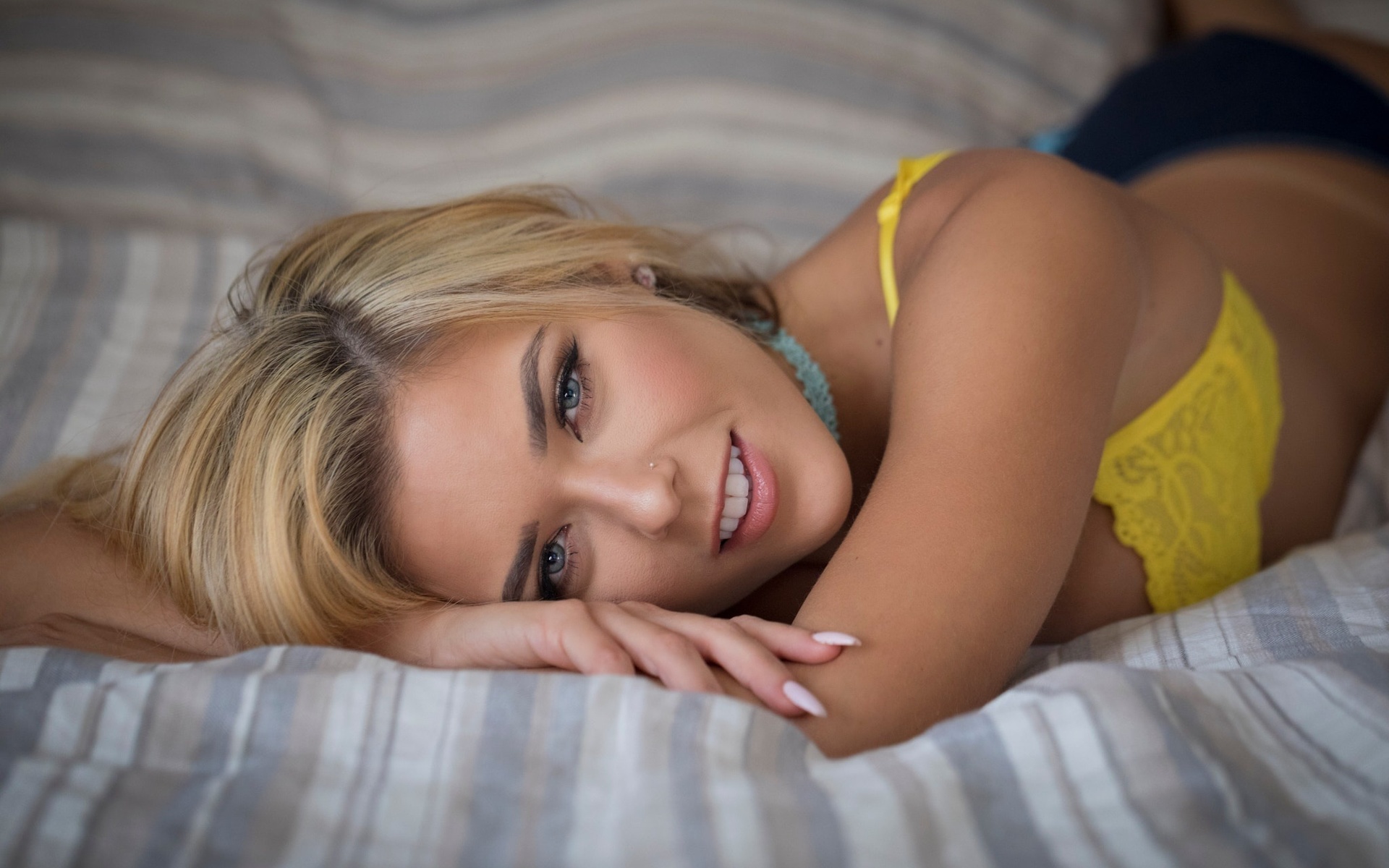neesy rizzo, women, blonde, smiling, lying on front, in bed, yellow bra, lingerie, tanned, pierced nose, gray eyes, choker, , , , ,   ,  ,  ,  ,  , 