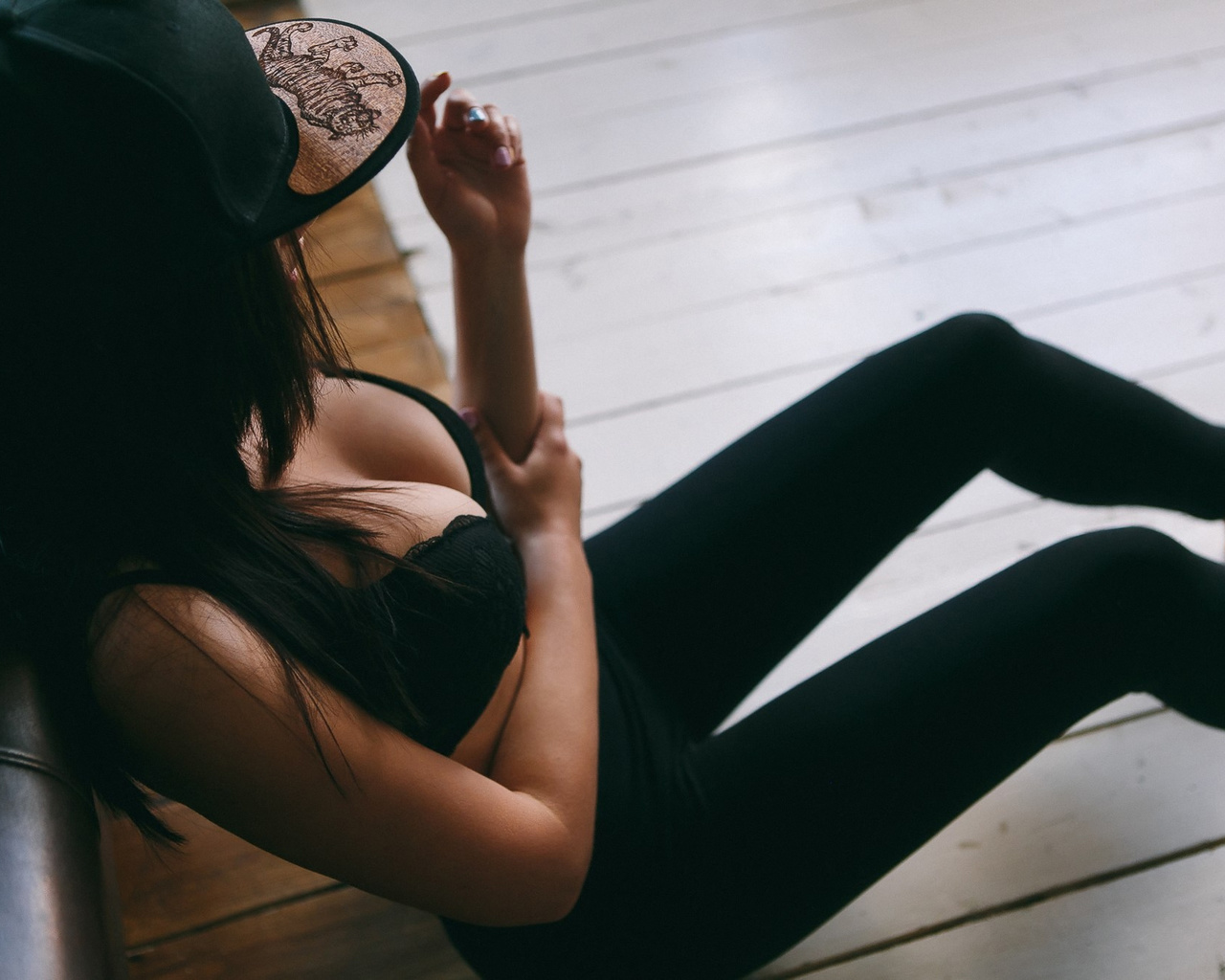 women, tanned, sitting, baseball caps, black bras, yoga pants