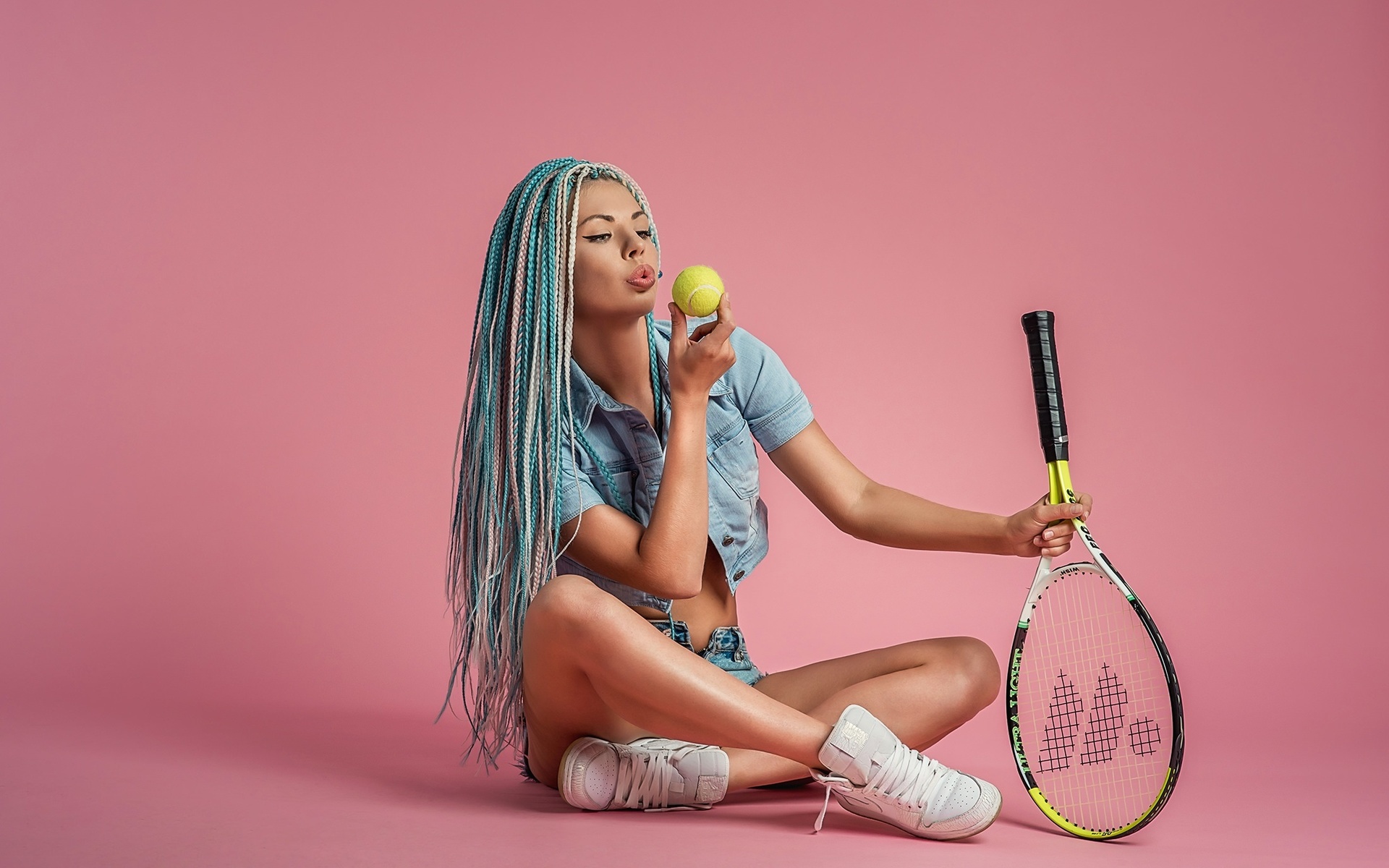 women, dreadlocks, portrait, pink background, denim, jean shorts, dyed hair, tanned, tennis balls, tennis rackets, sneakers, simple background, no bra, sitting, long hair, eyeliner,   ,georgy dyakov