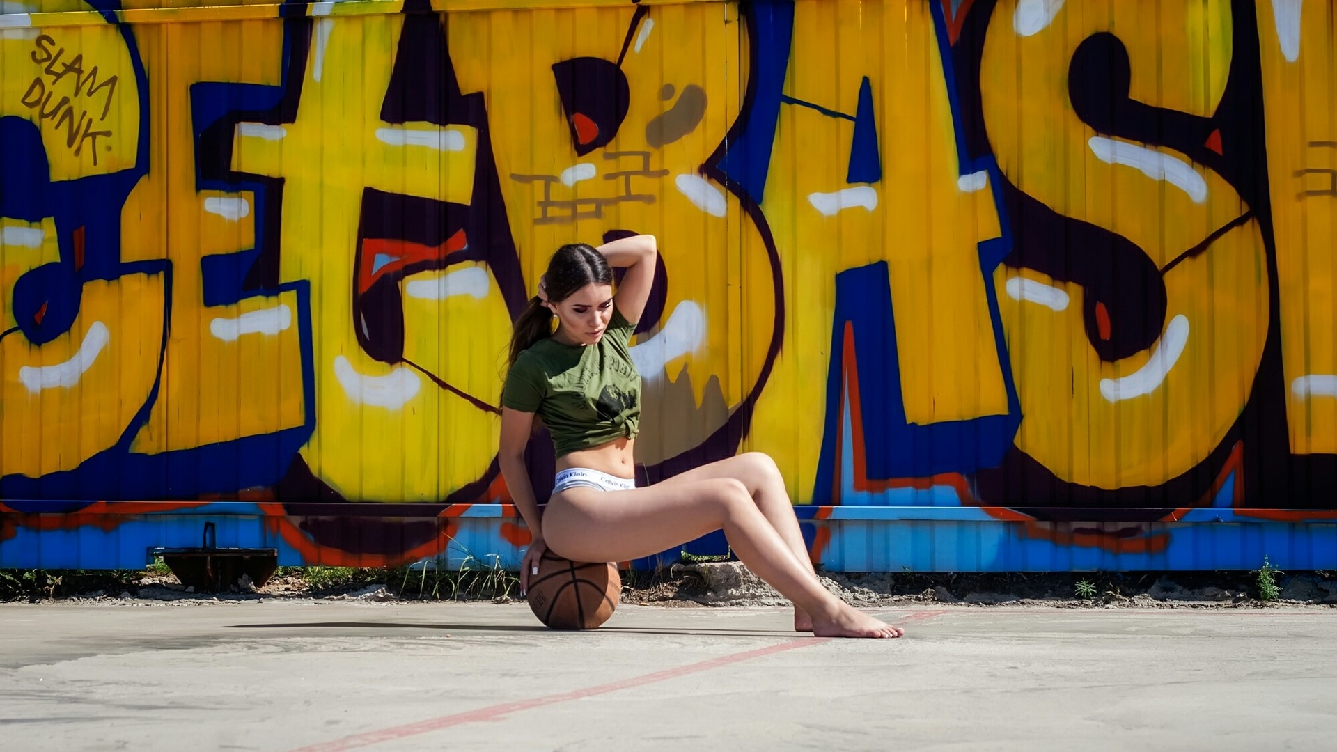 women, t-shirt, ball, sitting, calvin klein, belly, women outdoors, graffiti, brunette