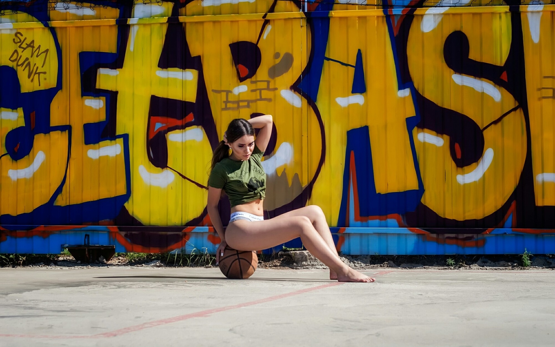 women, t-shirt, ball, sitting, calvin klein, belly, women outdoors, graffiti, brunette