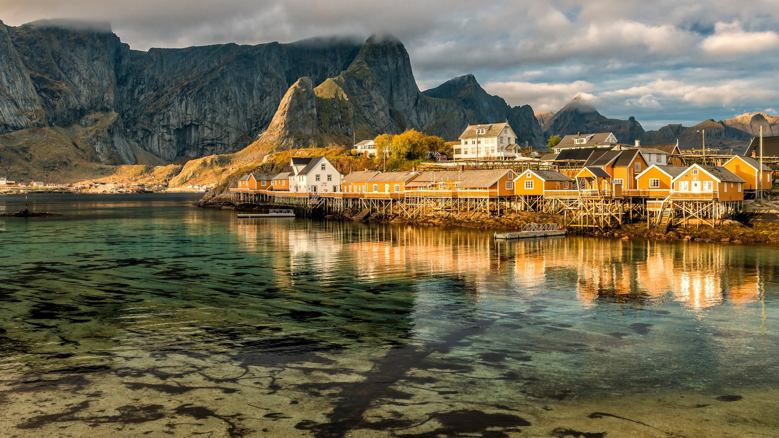 the sky, water, clouds, reflection, landscape, mountains, nature, rocks, shore, tops, the bottom, boats, norway, houses, pond, the village, piles, the lofoten islands