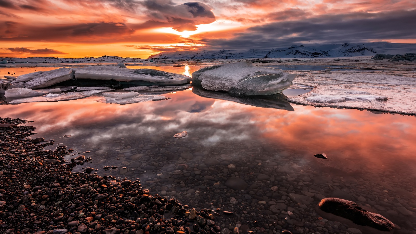 winter, the sky, the sun, clouds, snow, landscape, sunset, mountains, clouds, pebbles, reflection, stones, shore, ice, the evening