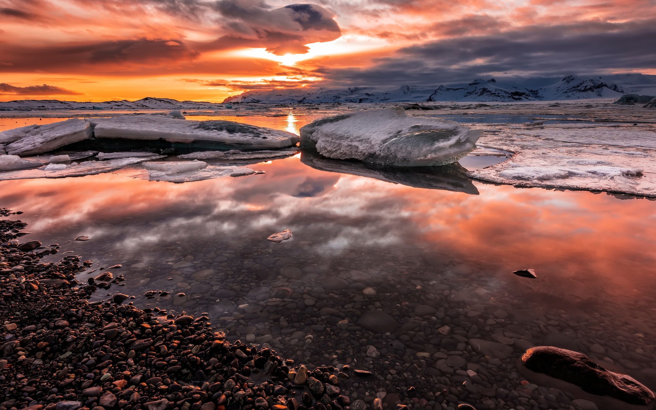 winter, the sky, the sun, clouds, snow, landscape, sunset, mountains, clouds, pebbles, reflection, stones, shore, ice, the evening