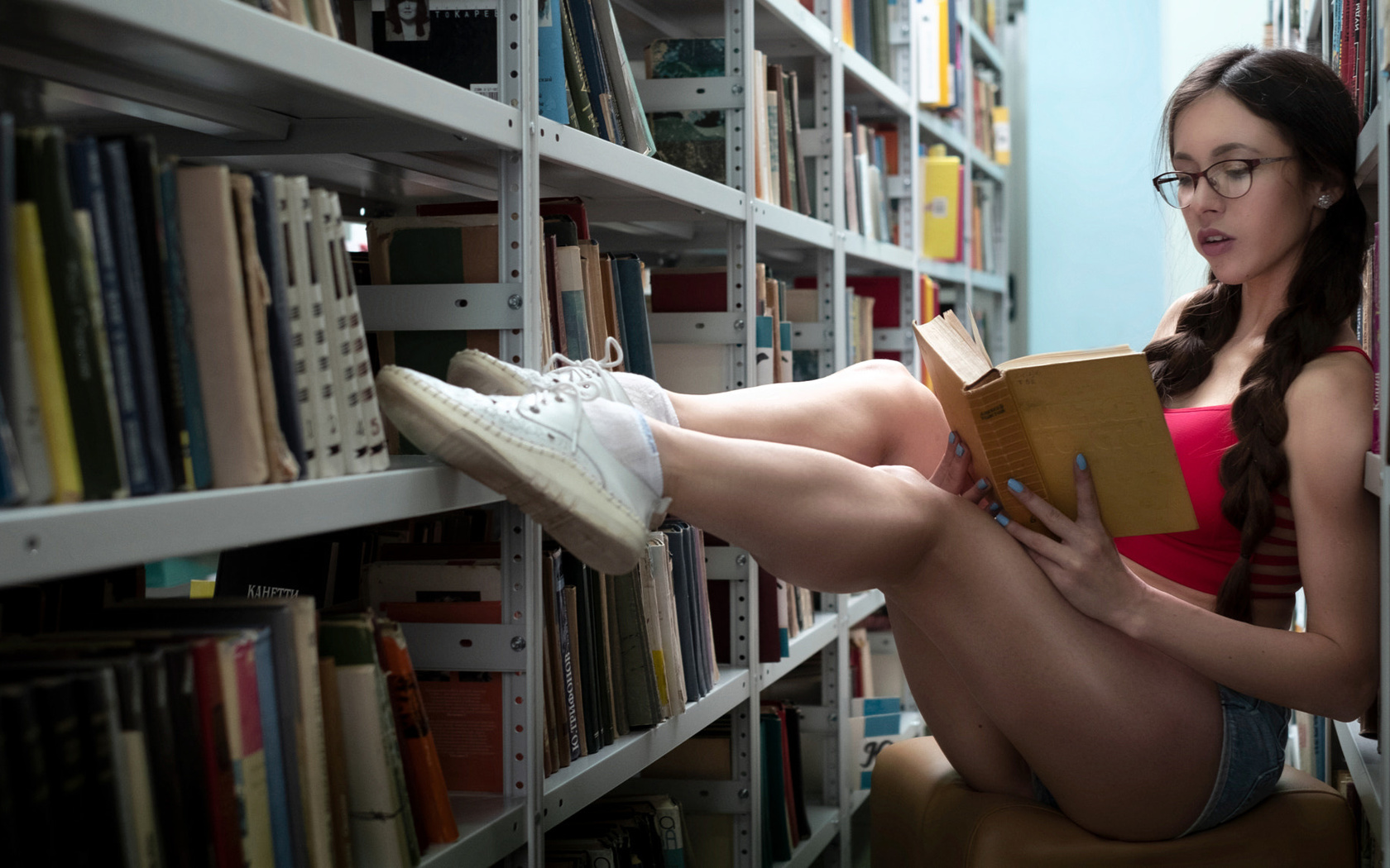 women, sitting, jean shorts, sneakers, books, pigtails, women with glasses, white socks, painted nails