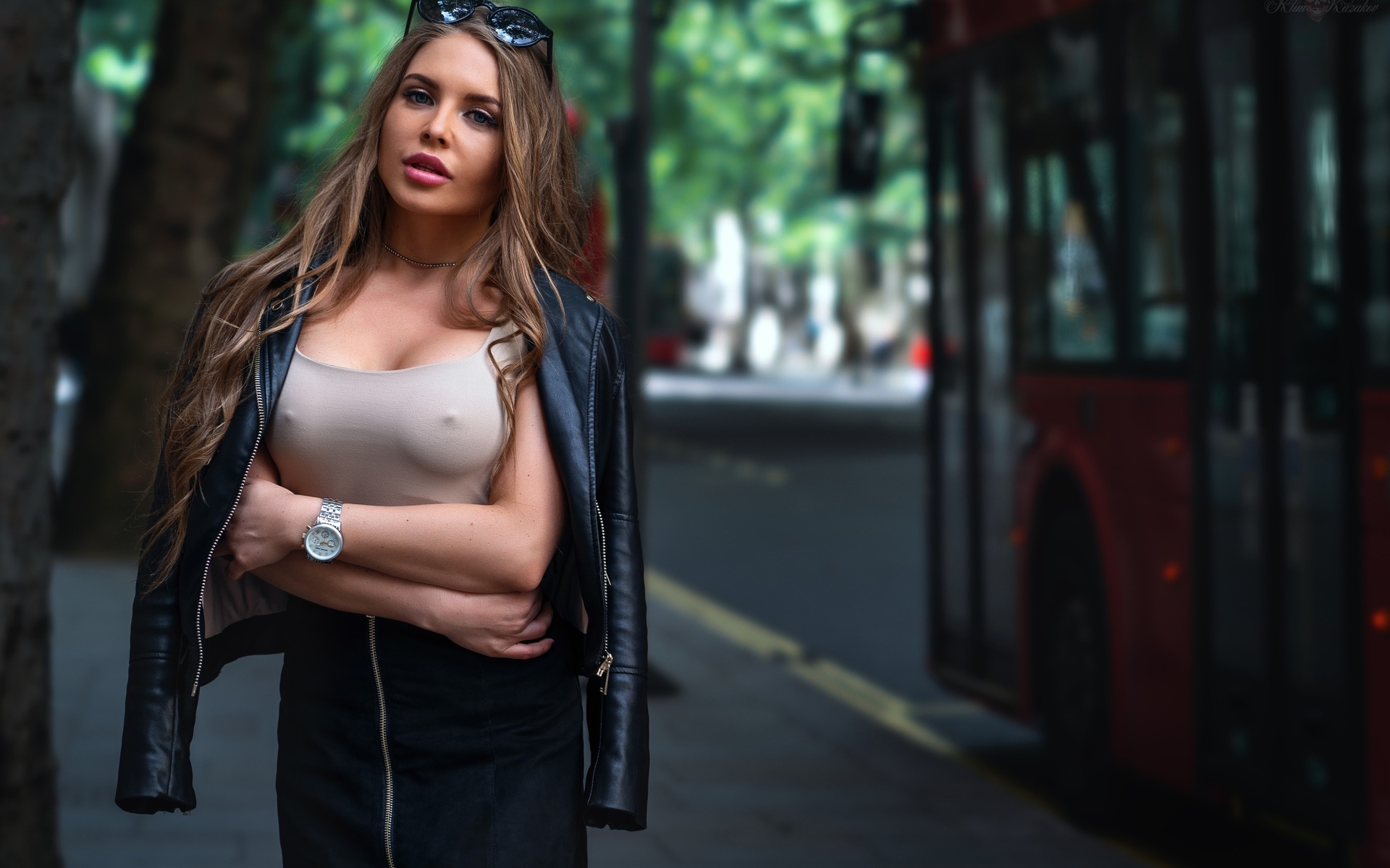 women, trees, buses, arms crossed, sunglasses, nipples through clothing, watch, leather jackets, pink lipstick, portrait